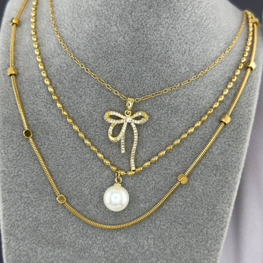Collier pendentif nœud en acier inoxydable plaqué or 18K avec zircone cubique, longueur de chaîne 41cm + 5cm, imperméable et hypoallergénique.